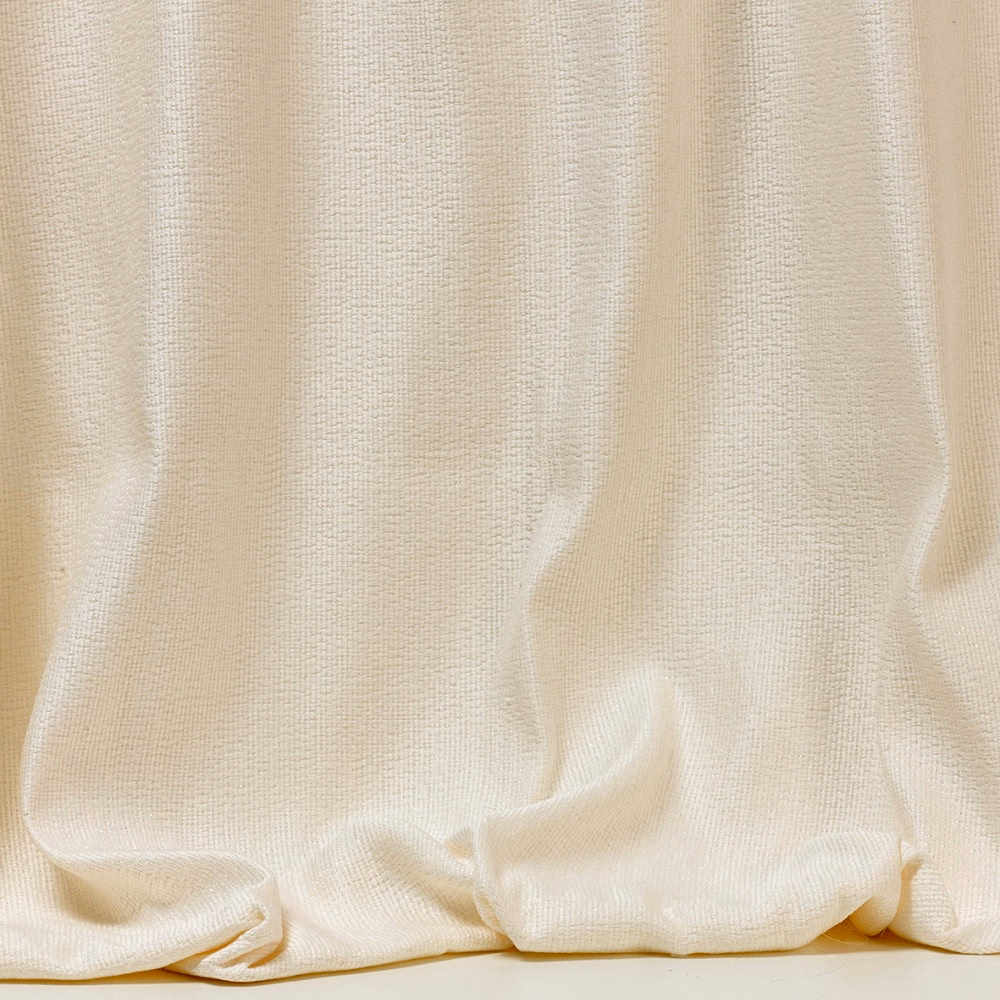 Soft ivory fine-weave fabric gathered into fluid vertical folds with a pooled hem