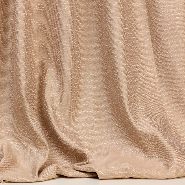 Warm sandy-beige woven fabric with fine texture and softly folded drape