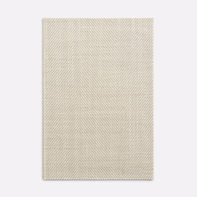 Pale greige herringbone textile with subtle vertical bands and a softly ridged weave