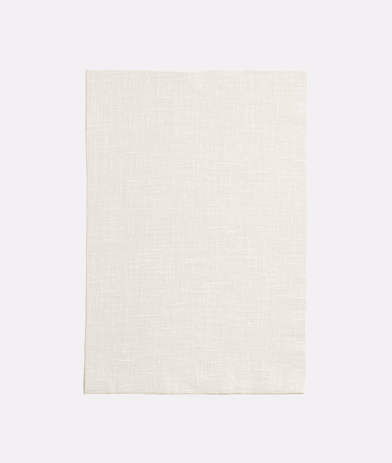 Warm ivory Lisboa Bianco swatch showing a fine, softly crosshatched woven surface