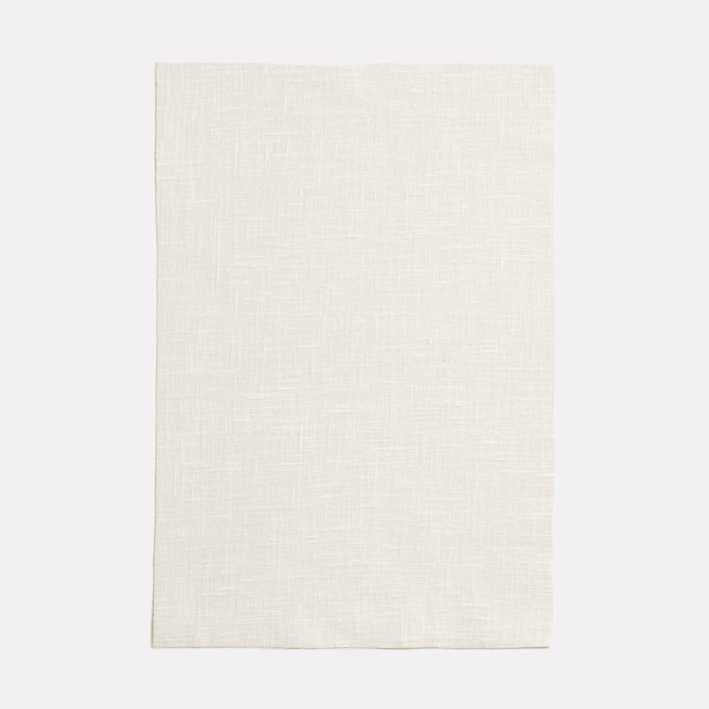 Warm ivory Lisboa Bianco swatch showing a fine, softly crosshatched woven surface