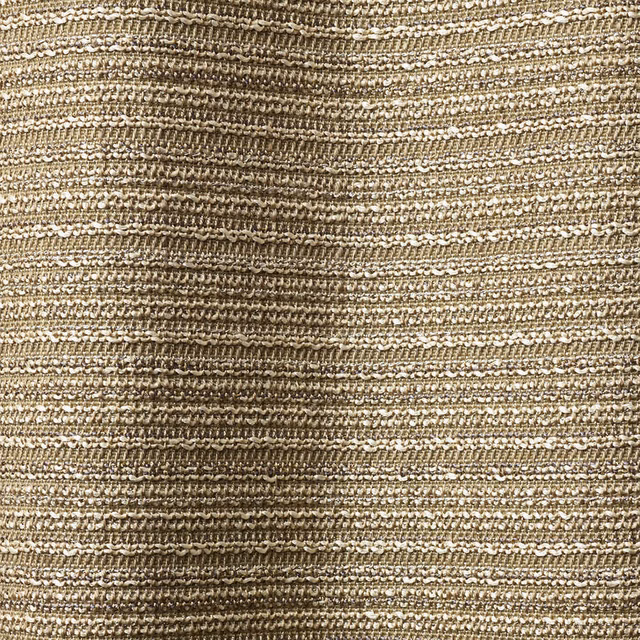 Close-up of Lucillo Natural’s warm beige, irregular horizontal textured weave