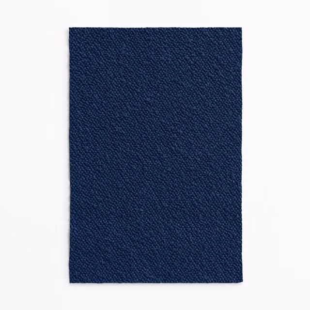 Deep admiral-blue textile swatch with fine pebbled weave and subtle tonal variation