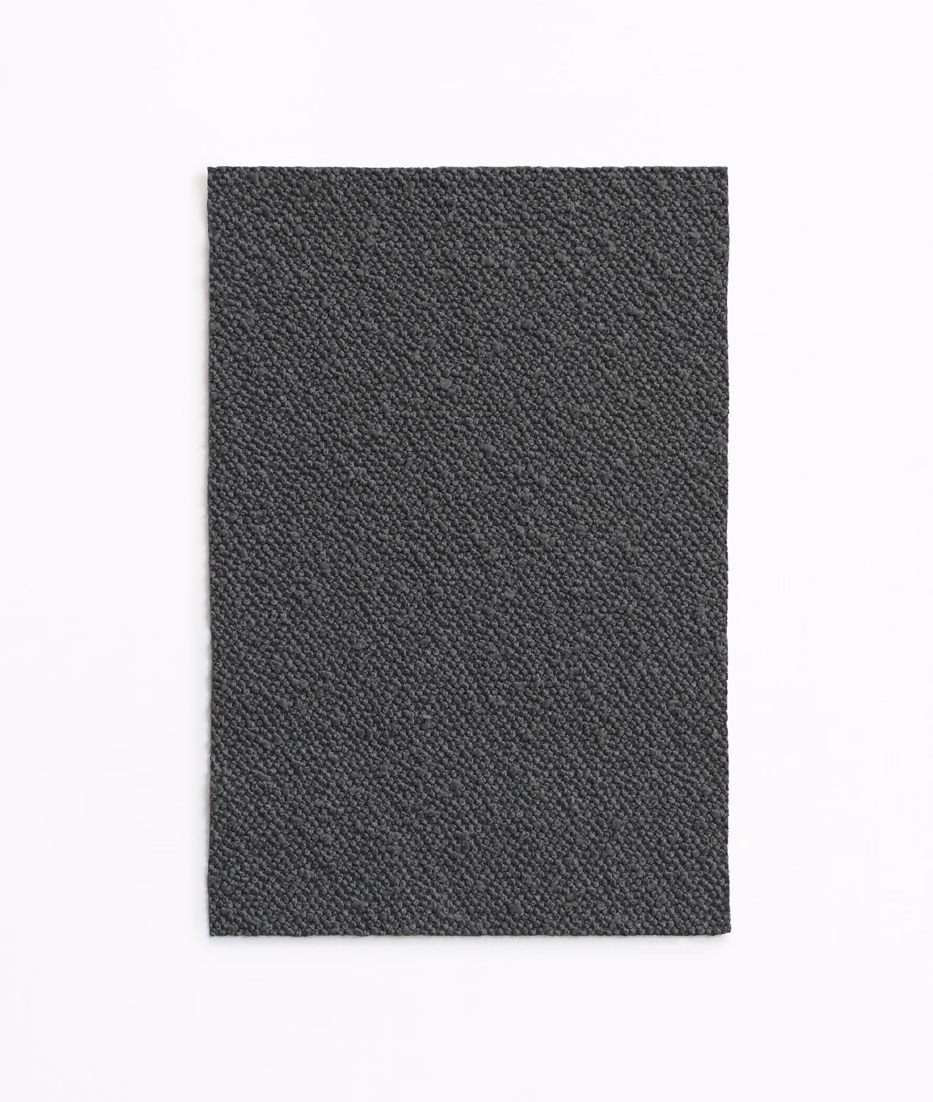 Near-black charcoal textile swatch with dense, subtly pebbled woven texture
