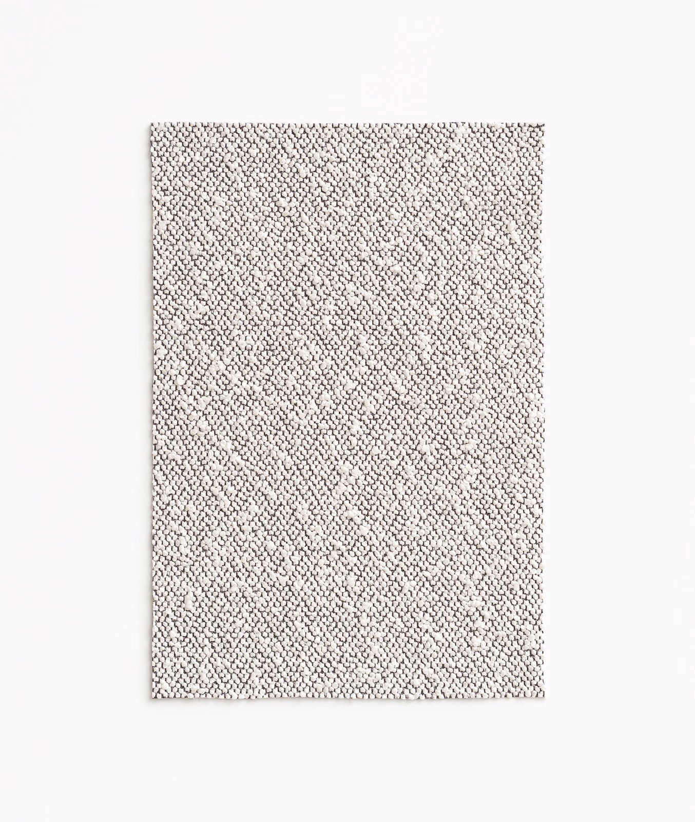 Pale greige taupe fabric with dense tiny flecks and a softly pebbled weave