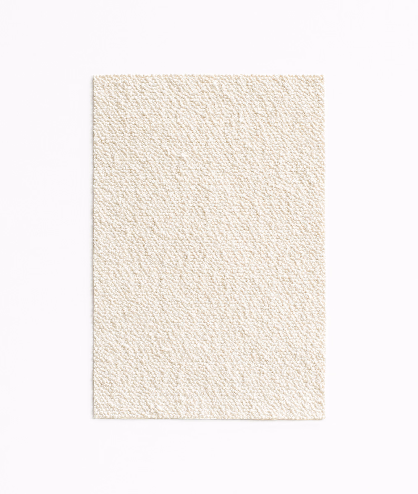 Pale petit-lait cream textile with a fine, irregular nubby weave