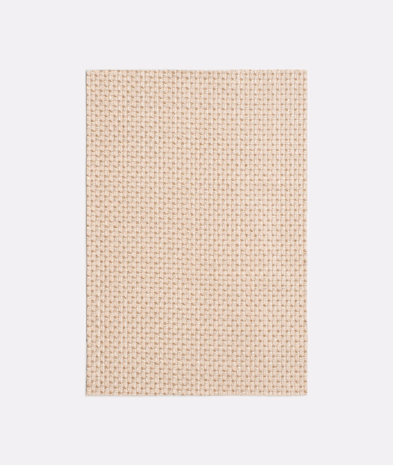 Pale blush-rose Dedar textile with a tightly packed miniature basket weave