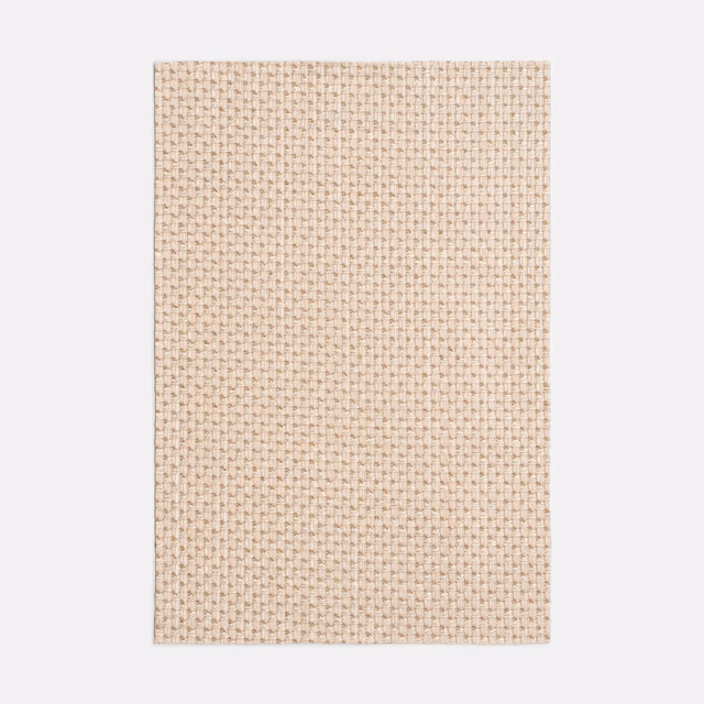Pale blush-rose Dedar textile with a tightly packed miniature basket weave