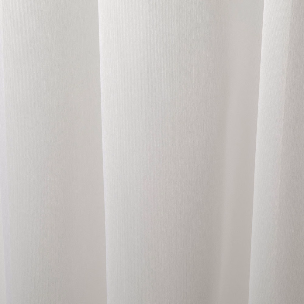 Soft ivory-white cloth falling in smooth vertical curtain folds