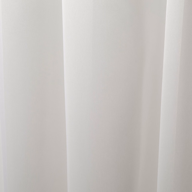 Soft ivory-white cloth falling in smooth vertical curtain folds