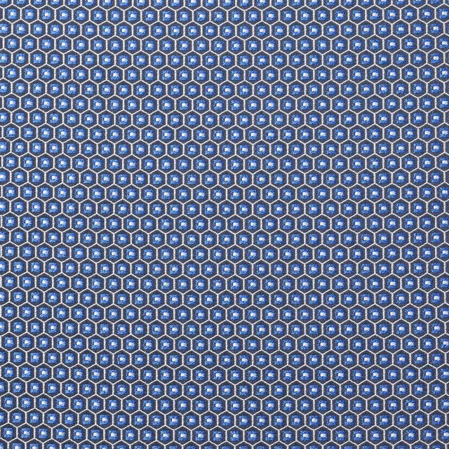 Electric blue textile with tiny navy-outlined hexagons and white central flecks