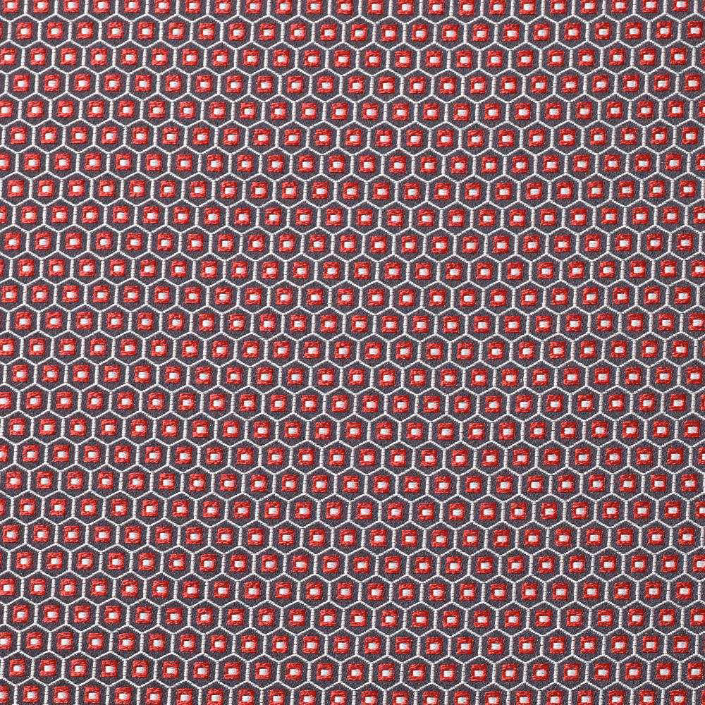 Dense chili-red geometric weave with charcoal outlines and tiny cream accents