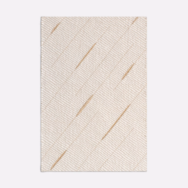 Warm ivory woven textile with fine diagonal ribs and sparse ochre-gold slashes