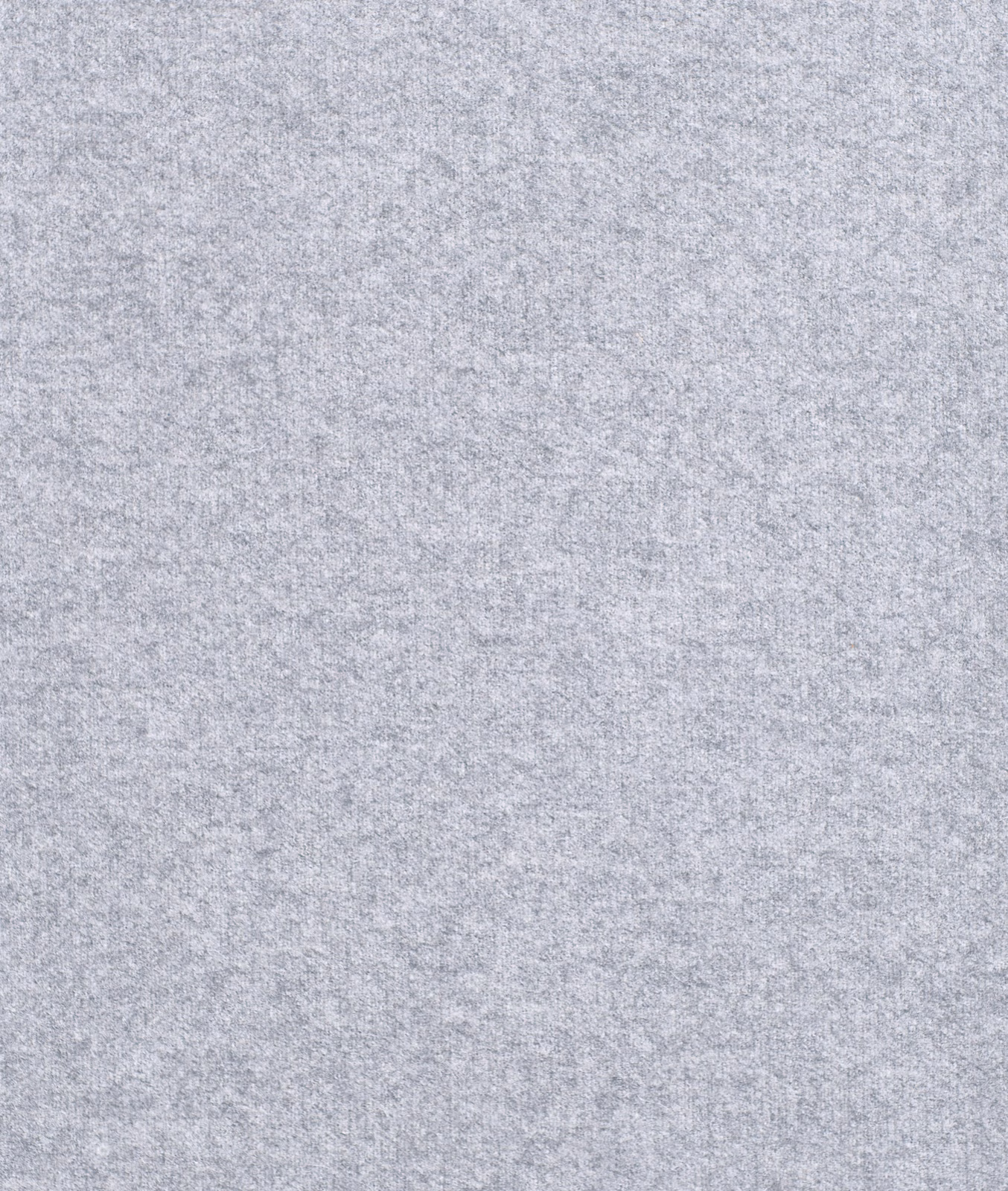 Close-up of pale cool grey fabric with a softly mottled heathered texture