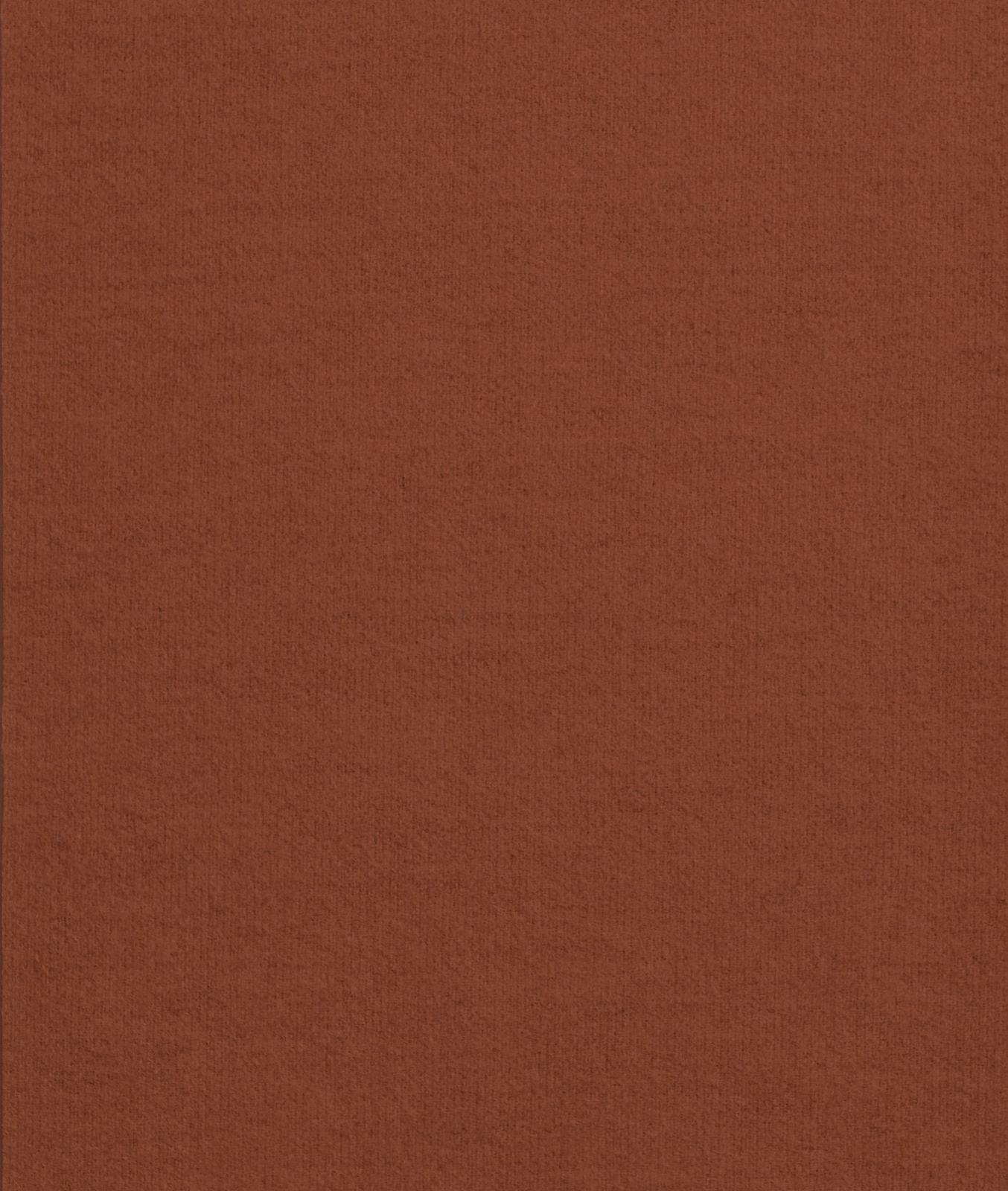 Close-up of deep rust terracotta fabric with a subtle fine woven texture
