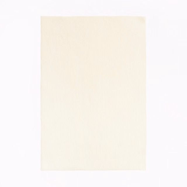 Close view of warm ivory fabric with a soft, fine vertical weave
