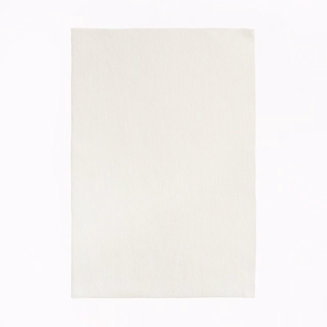 Pale ivory textile swatch with subtle vertical tonal texture and softly brushed surface