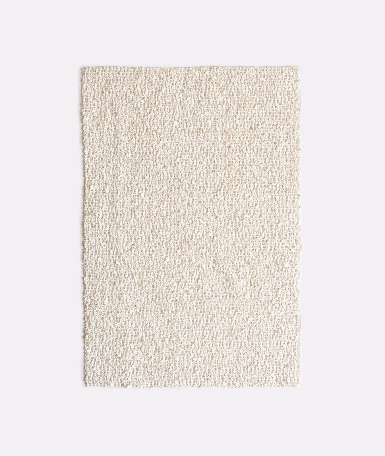 Warm ivory nubby woven fabric swatch with softly flecked natural texture