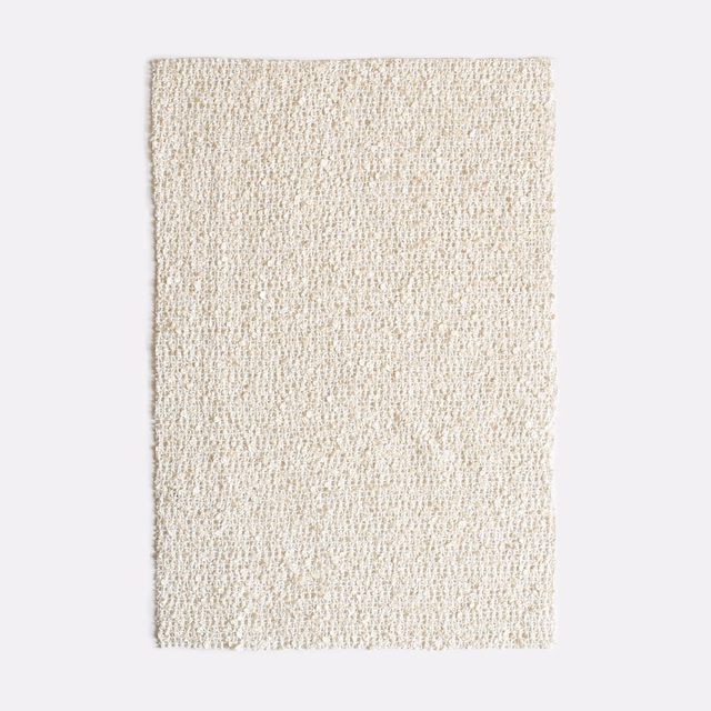 Warm ivory nubby woven fabric swatch with softly flecked natural texture
