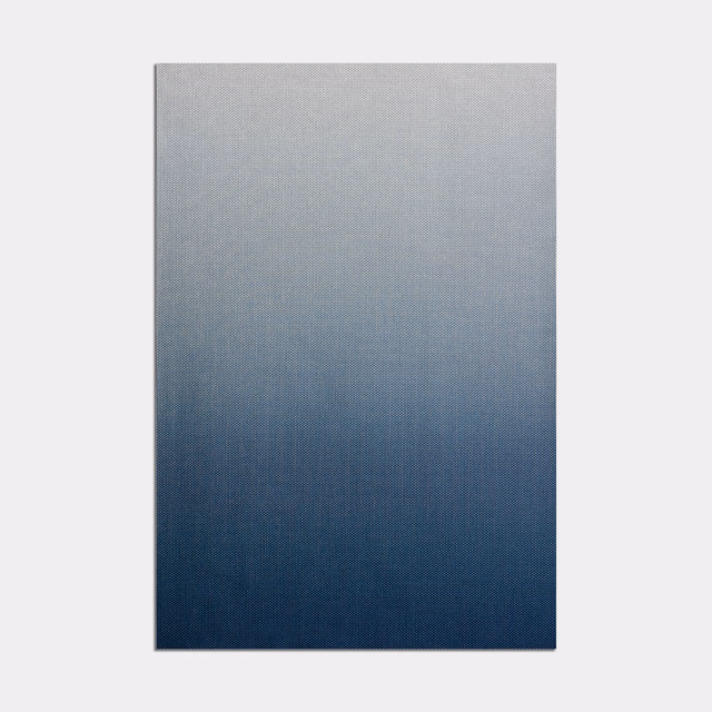 Cool grey-blue fading into deep navy with a fine, even textile weave