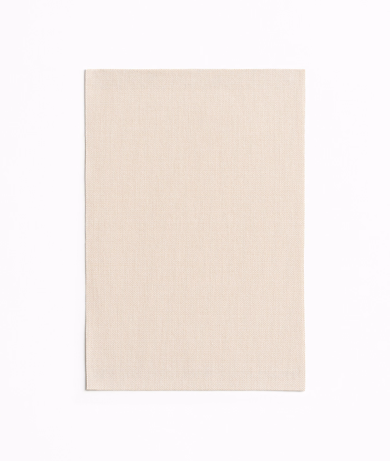 Pale blush-beige textile showing a fine, even plain weave