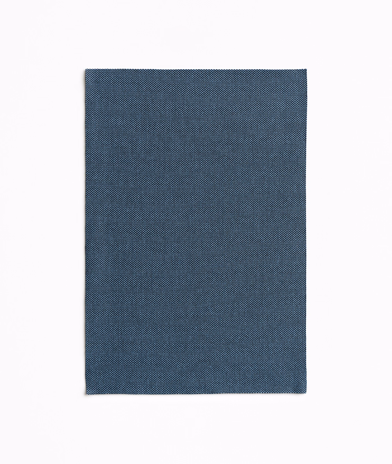 Deep denim blue fabric swatch with a fine, tightly woven micro-texture