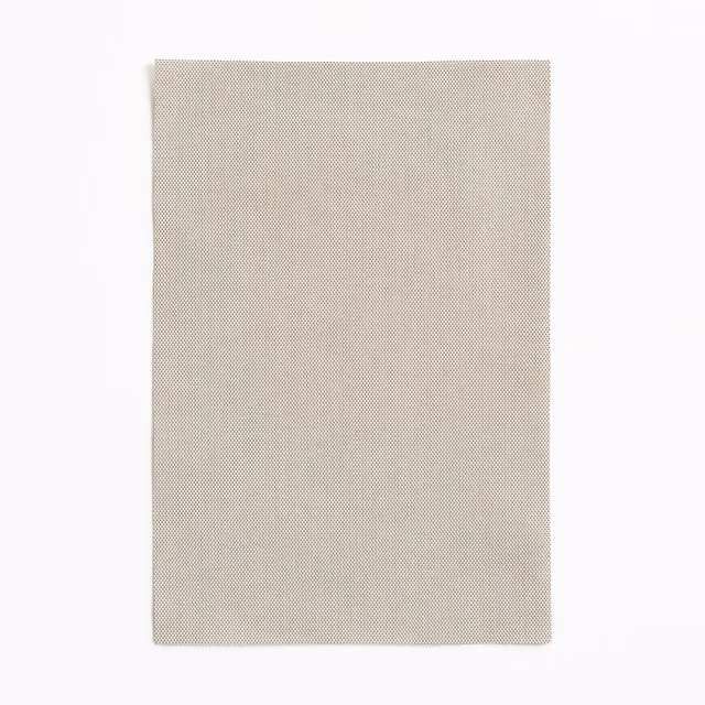 Pale taupe-beige swatch with a fine, tightly patterned micro-weave and soft matte texture