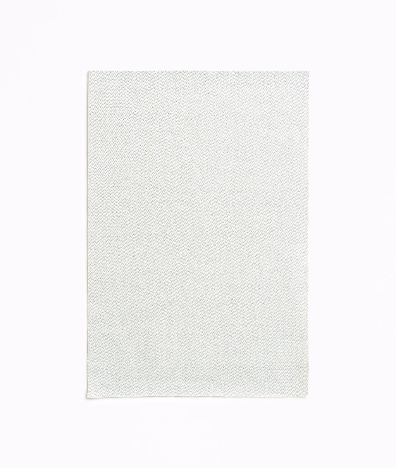 Cool near-white Rebus Ice swatch with a fine, subtly diagonal woven texture