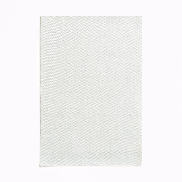Cool near-white Rebus Ice swatch with a fine, subtly diagonal woven texture