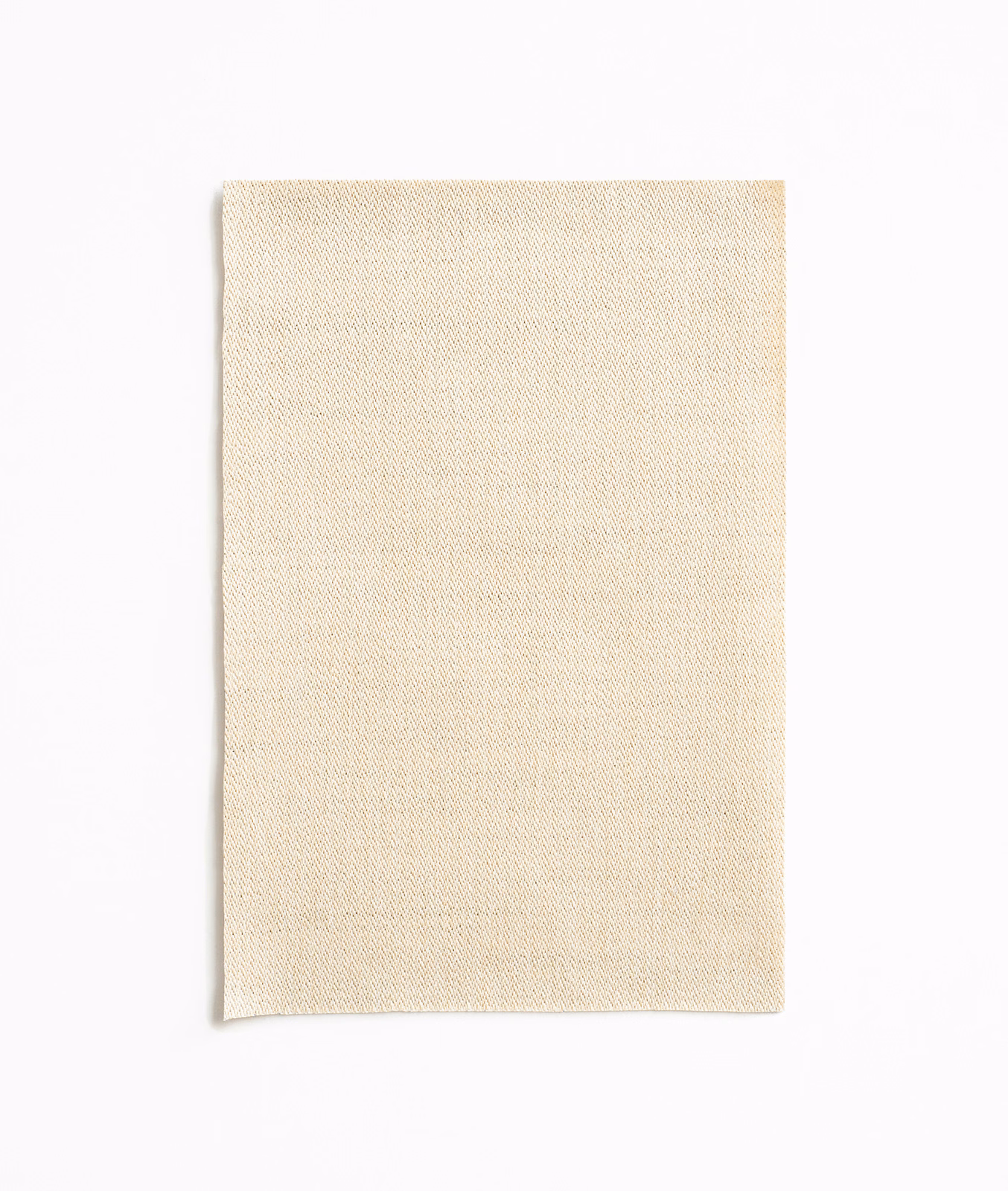 Light warm sand fabric swatch with fine, subtly textured woven surface