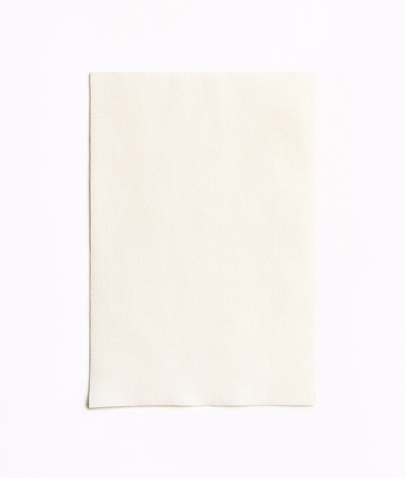 Warm ivory textile swatch with a fine, barely visible vertical weave