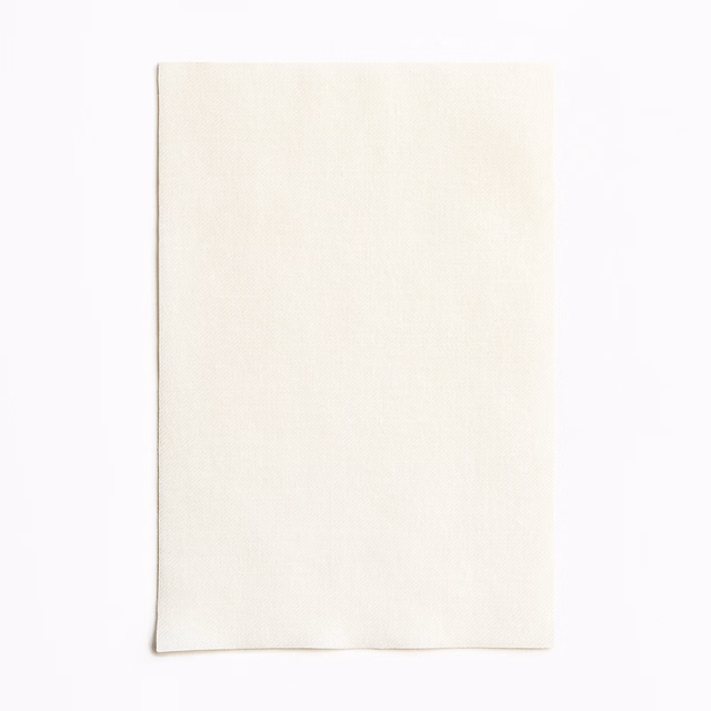 Warm ivory textile swatch with a fine, barely visible vertical weave