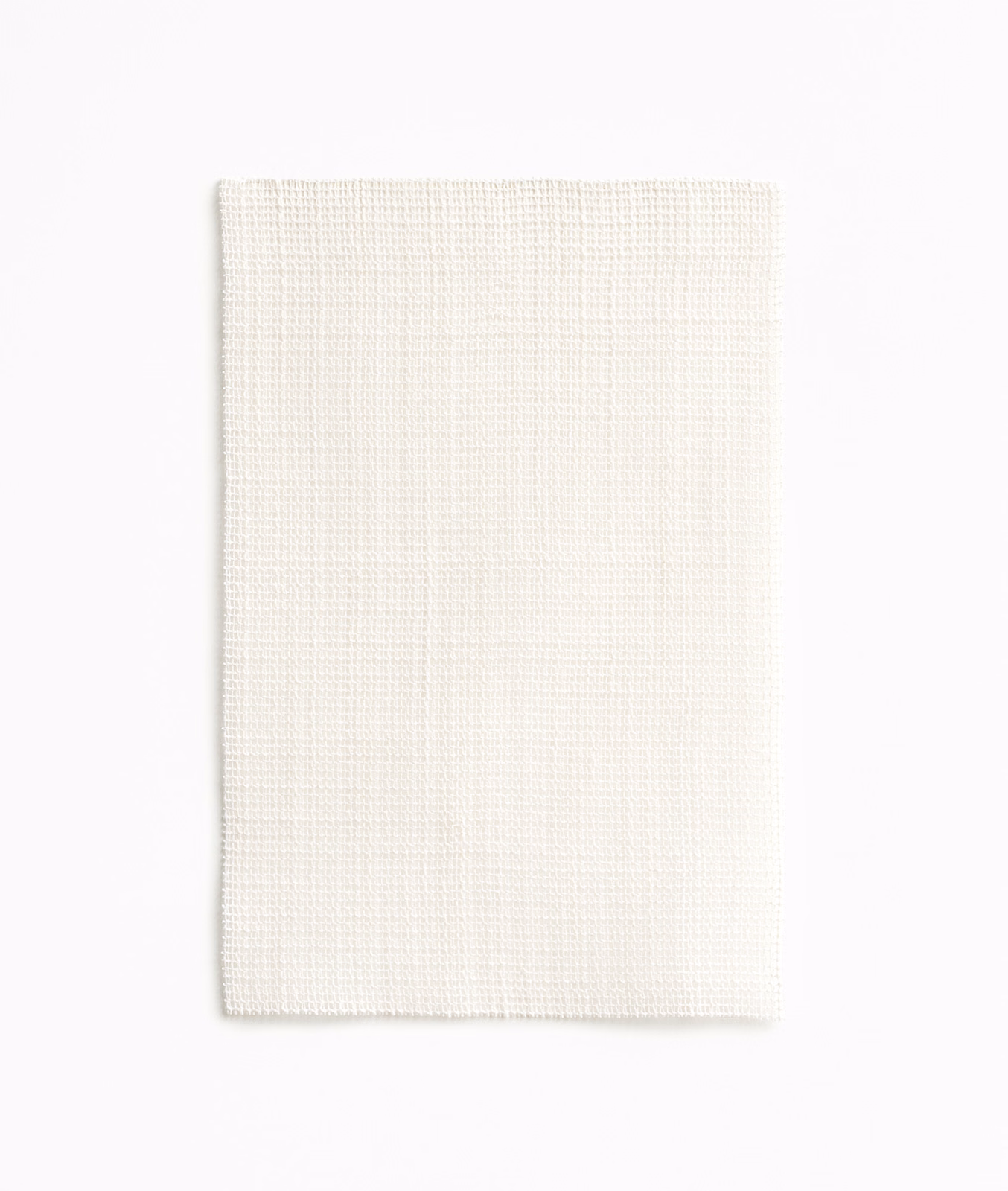 Warm ivory fabric with a fine, regular crosshatch weave and softly textured surface