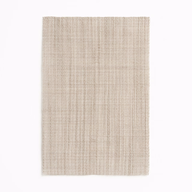 Pale warm greige woven swatch with fine vertical striations and soft texture