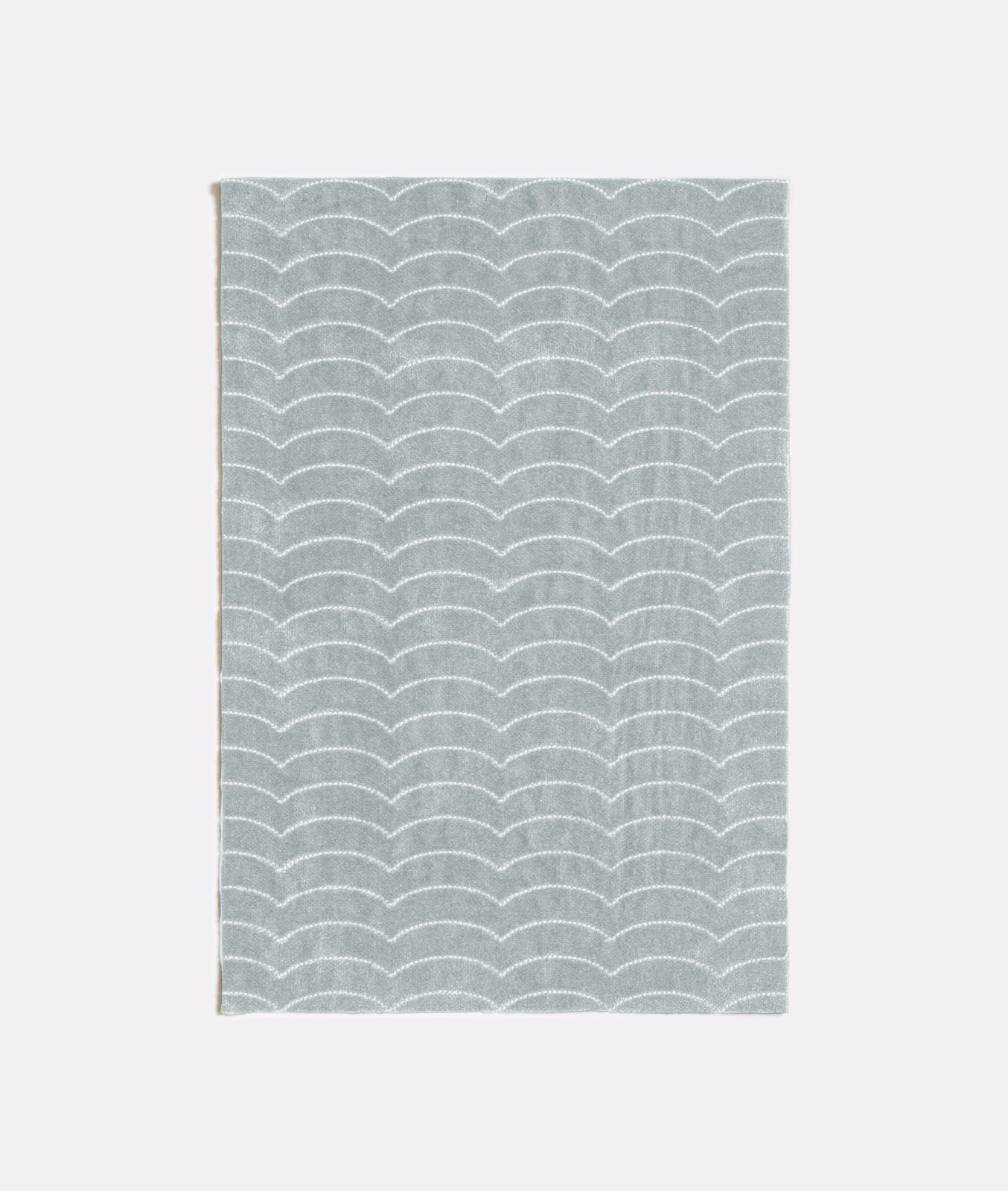 Celadon grey-green woven swatch with fine white scalloped wave rows