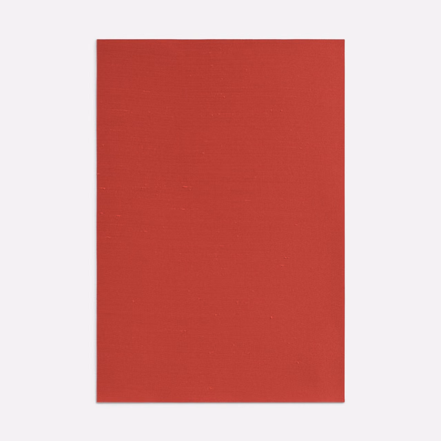 Deep geranium-red plain fabric swatch with a fine horizontal woven texture