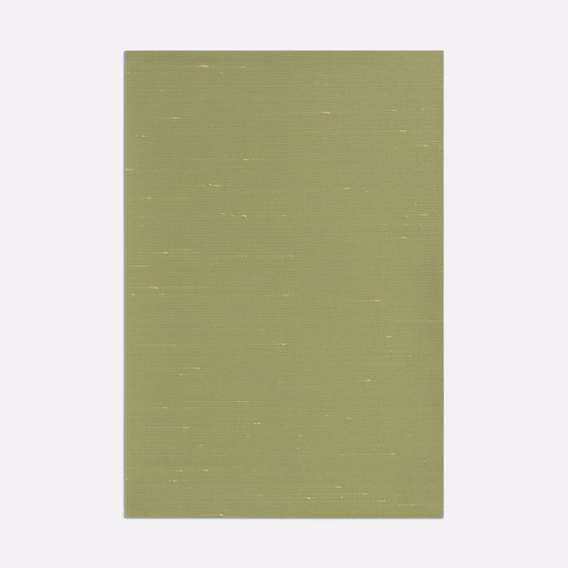 Muted lime-olive ribbed fabric with tiny pale flecks across its woven surface