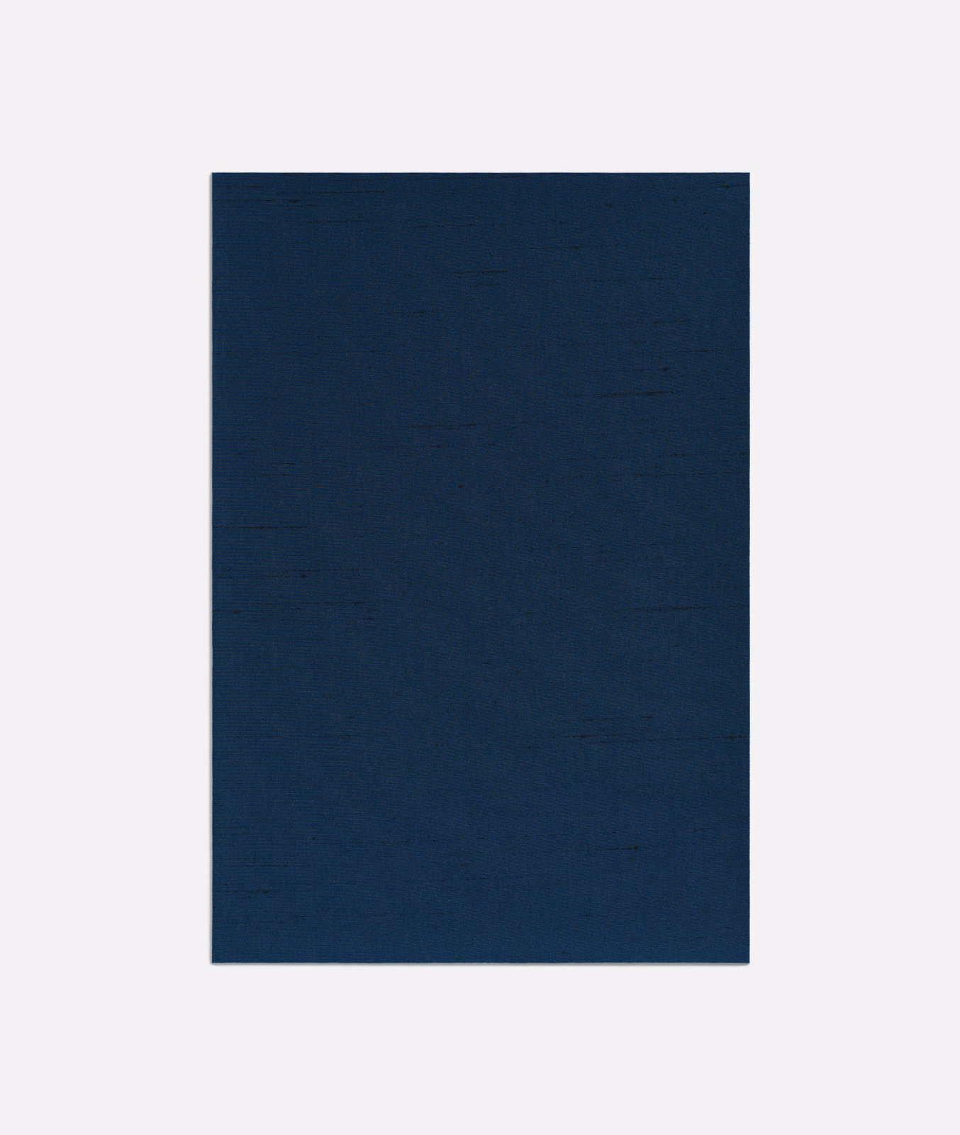 Deep navy plain weave with subtle horizontal slubs and softly uneven tonal depth