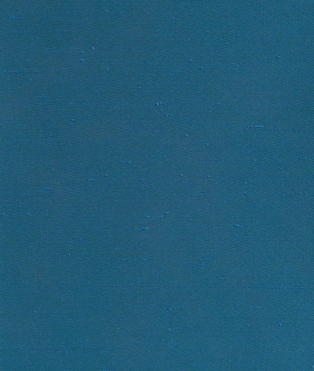 Deep Prussian teal fabric with fine ribbing and scattered subtle slub marks