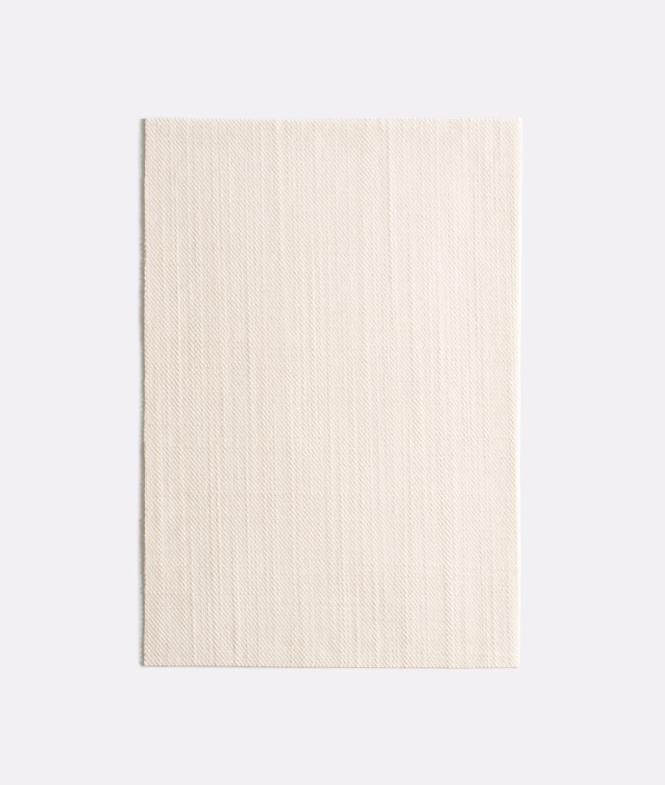 Warm ivory swatch with fine vertical striations and a softly matte woven surface