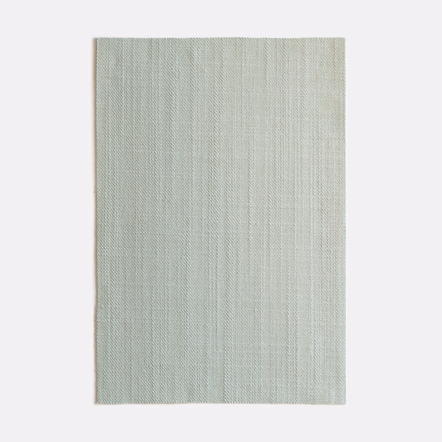 Pale celadon fabric swatch with fine vertical striations and soft woven texture