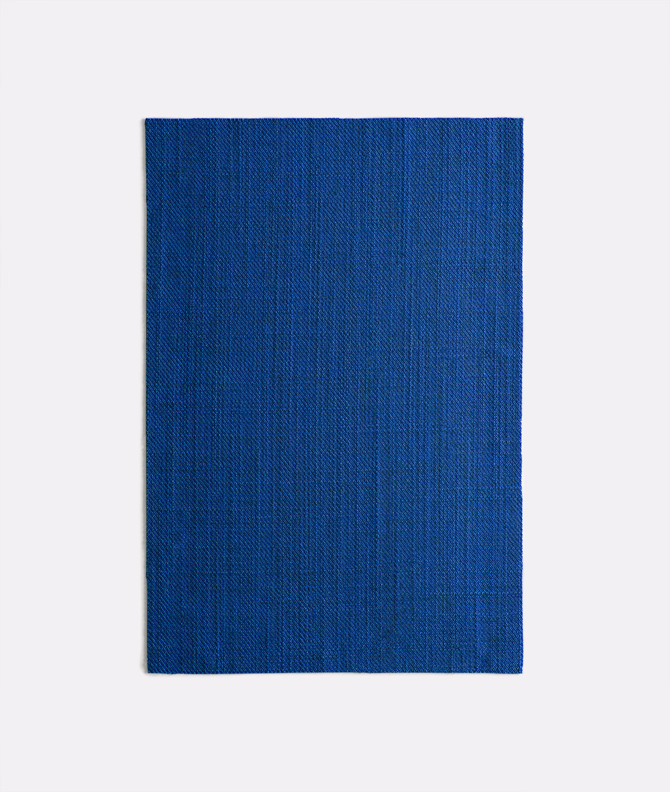Saturated cobalt blue woven fabric swatch with fine vertical striations and subtle texture