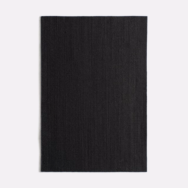 Near-black woven swatch with subtle diagonal ribbing and vertical tonal depth