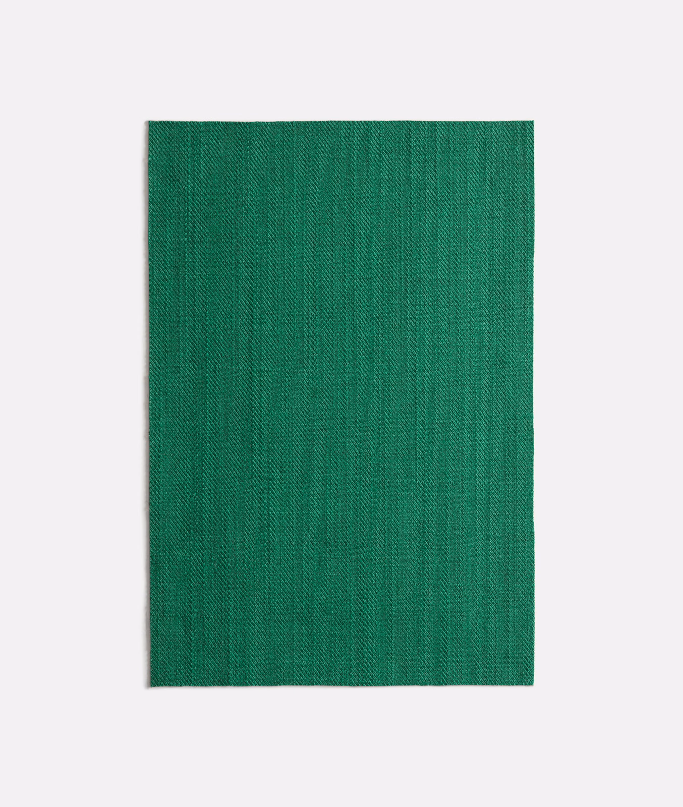 Deep malachite green woven fabric with subtle vertical striations and fine texture