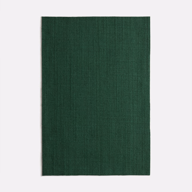 Deep forest-green woven swatch with subtle vertical striations and a dark matte surface