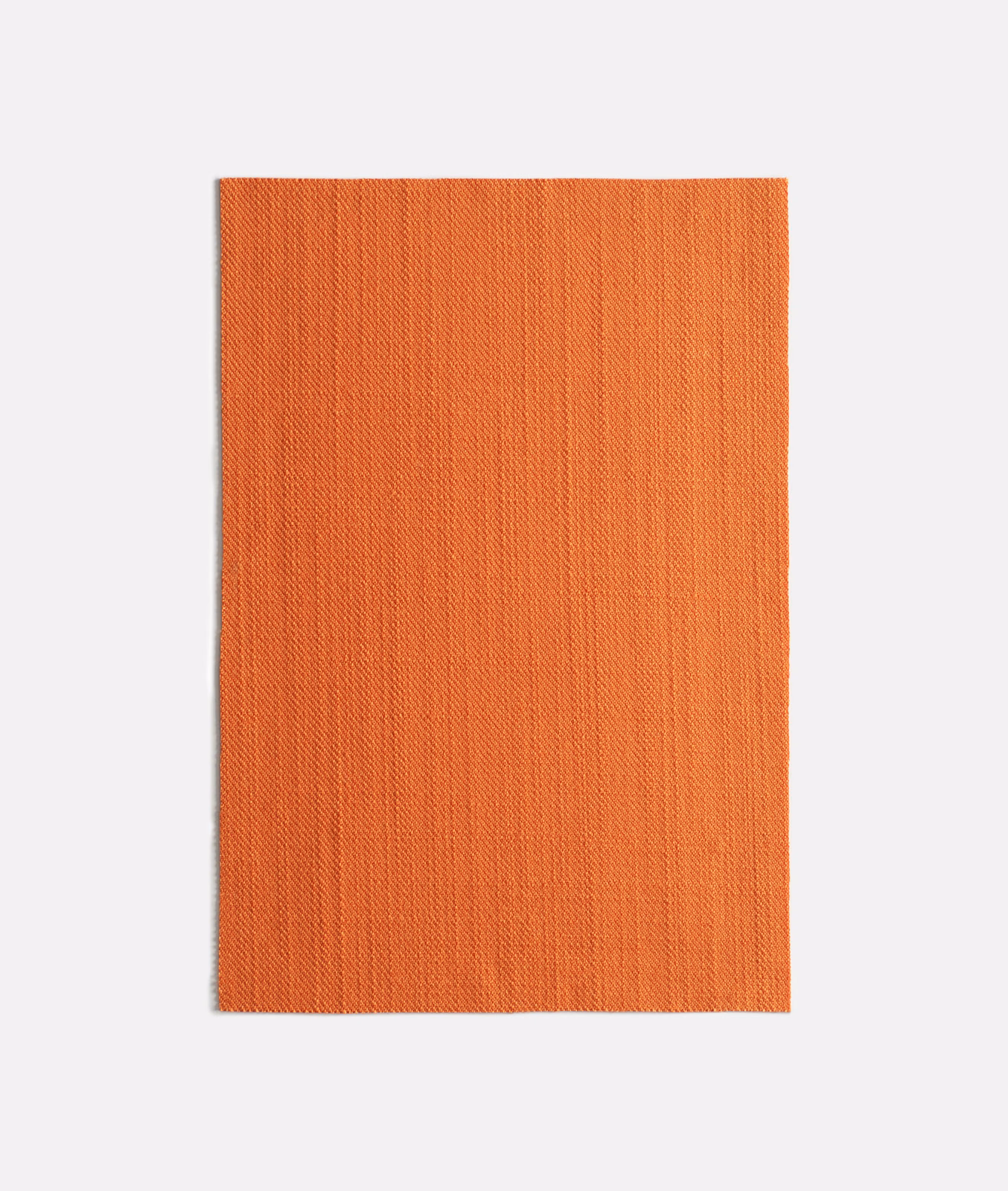 Close view of terracotta-orange Very Zucca with fine, subtly rippled vertical weave