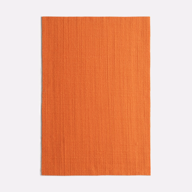 Close view of terracotta-orange Very Zucca with fine, subtly rippled vertical weave