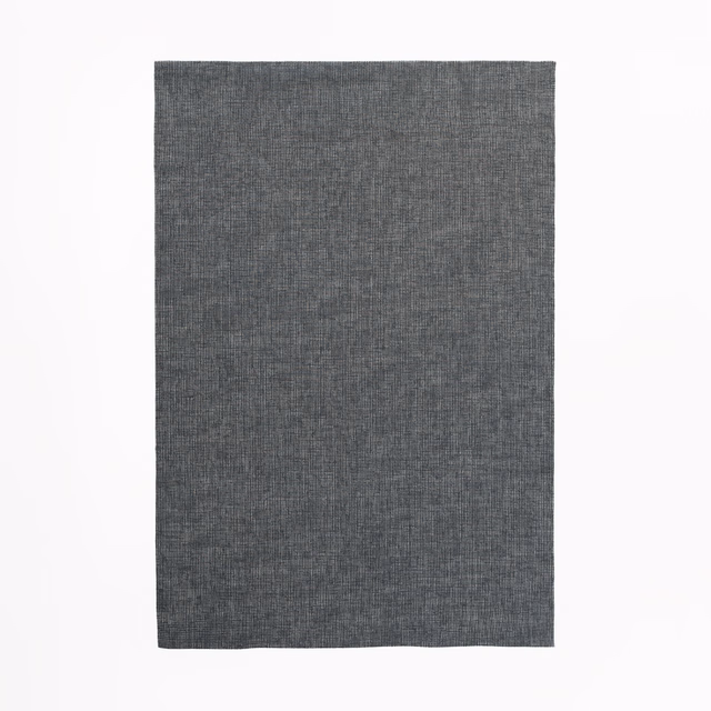 Cool charcoal-grey woven swatch showing a fine, softly irregular crosshatch texture