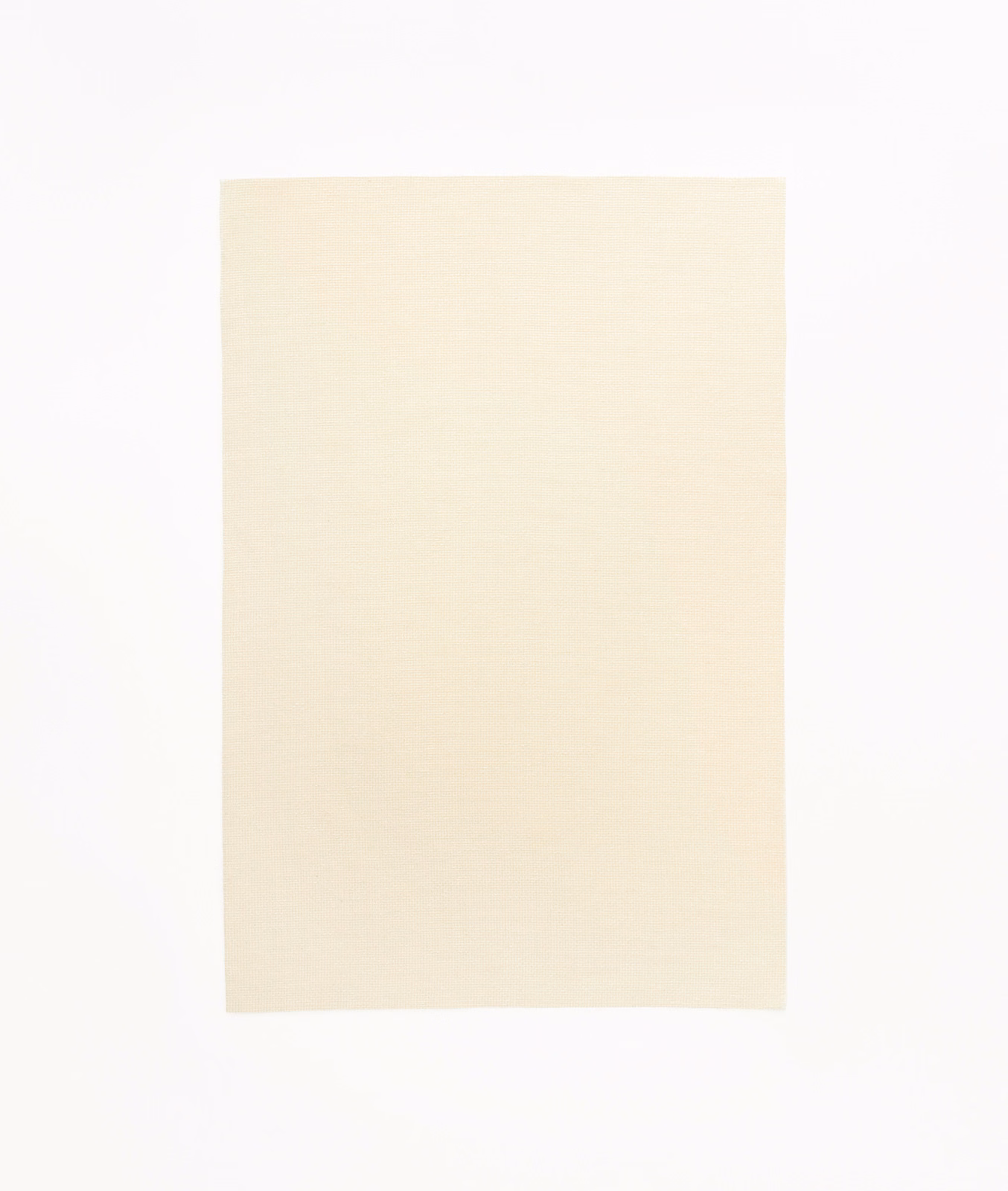 Pale warm-crema textile swatch with a subtle, even woven surface