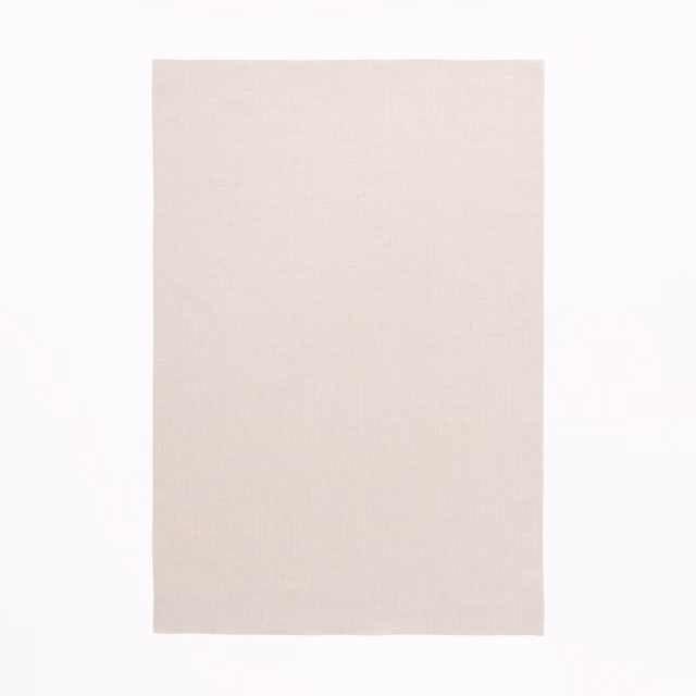 Pale warm greige swatch showing a fine, even textile weave